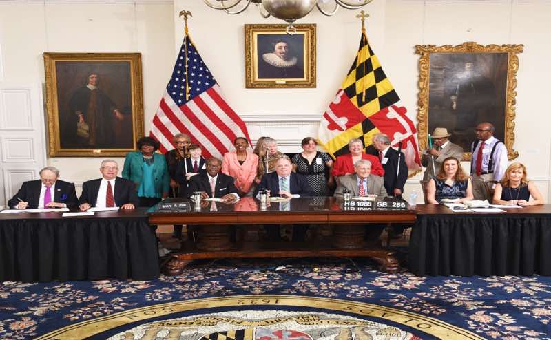 Shows Federationists and Sponsors Senator Joan Carter Conway and Delegate Bonnie Cullison looked on as Governor Hogan signed HB1088/SB286 into law on May 15, 2018.